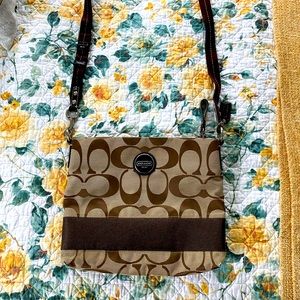 Brown over the shoulder/cross body Coach bag